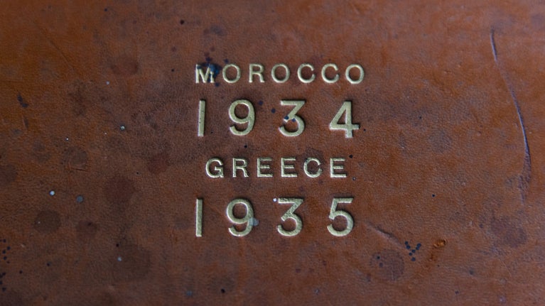 Gold embossed lettering on top of a worn album cover